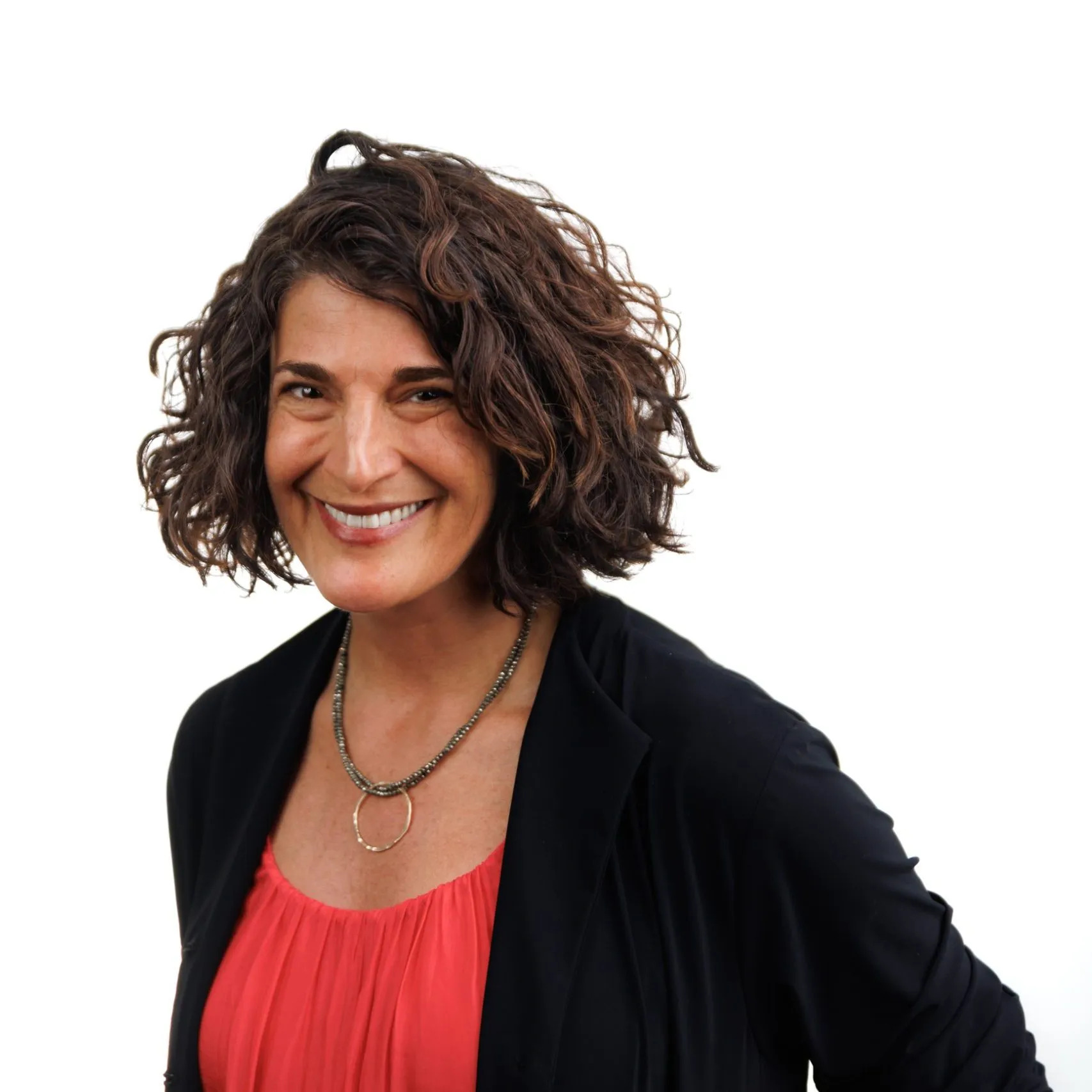 Jody K. Biehl, a white woman with a dark wavy bob, smiling