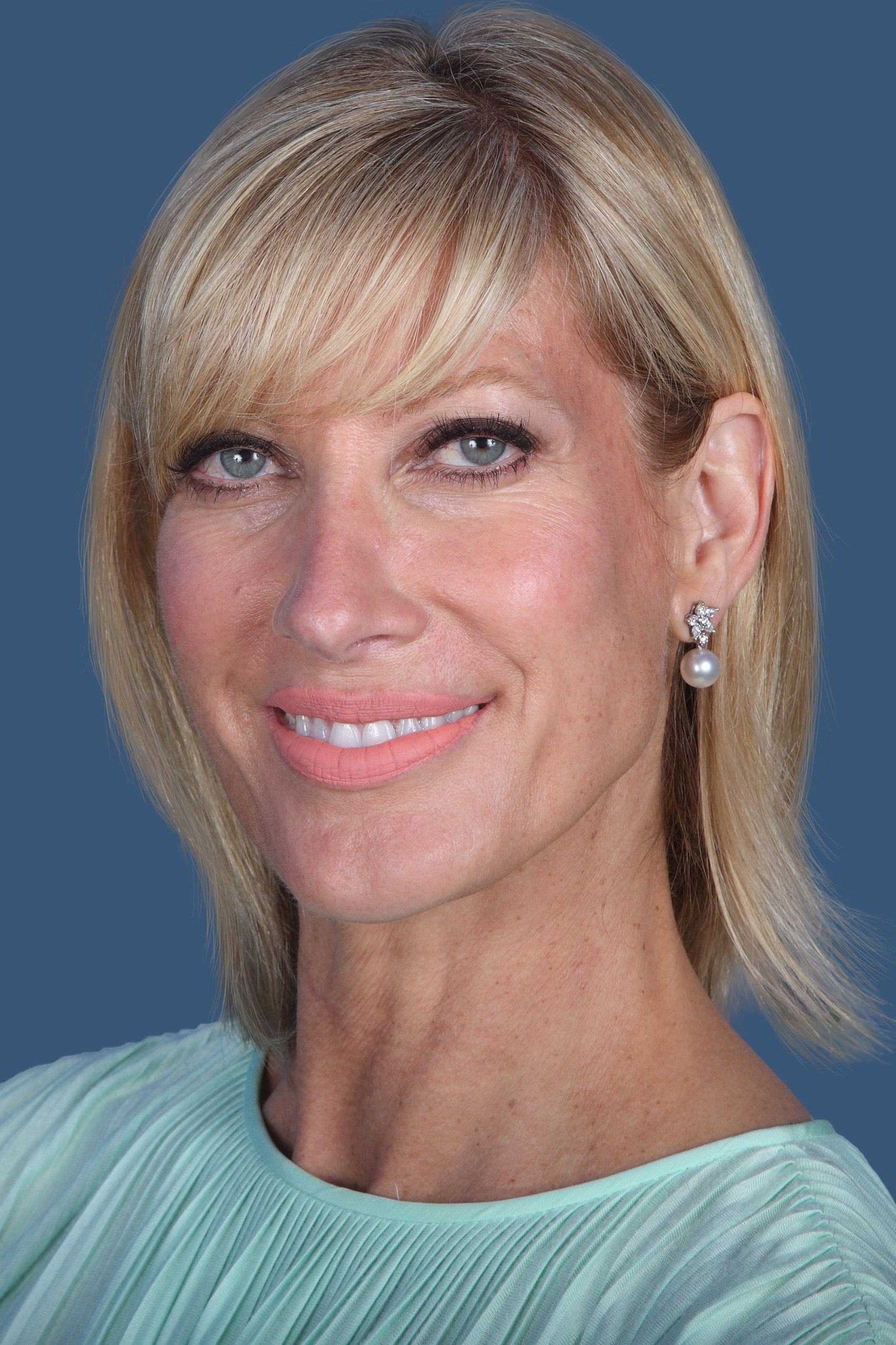 UC Regent Janet Reilly, woman with just above shoulder-length hair, mint dress