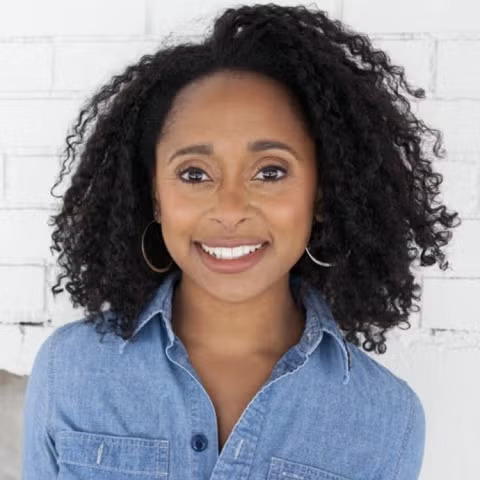 Woman in a blue shirt smiling