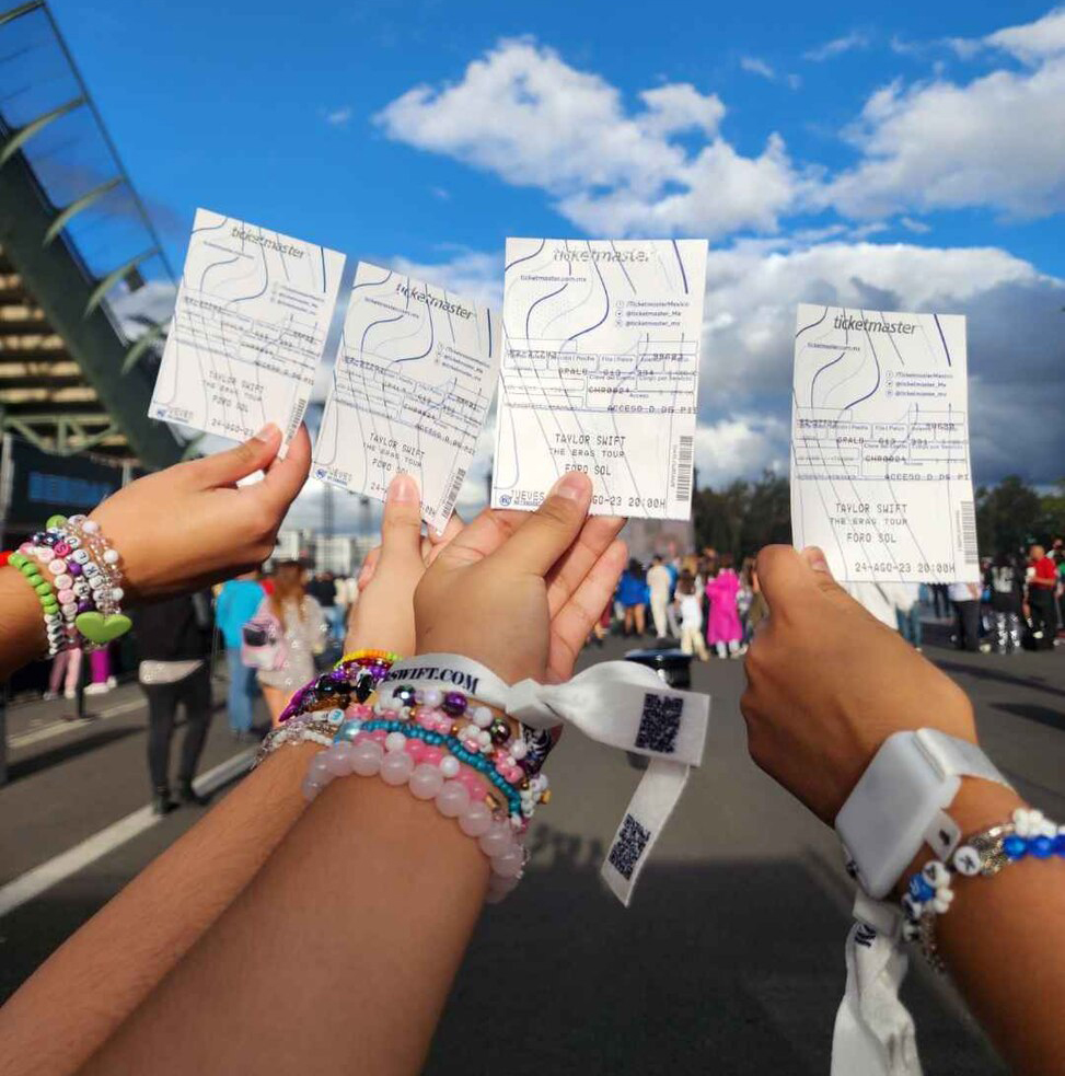 outstretched arms adorned with friendship bracelets