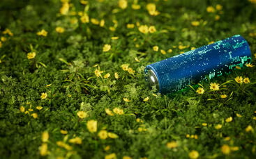 A battery on a bed of grass and flowers