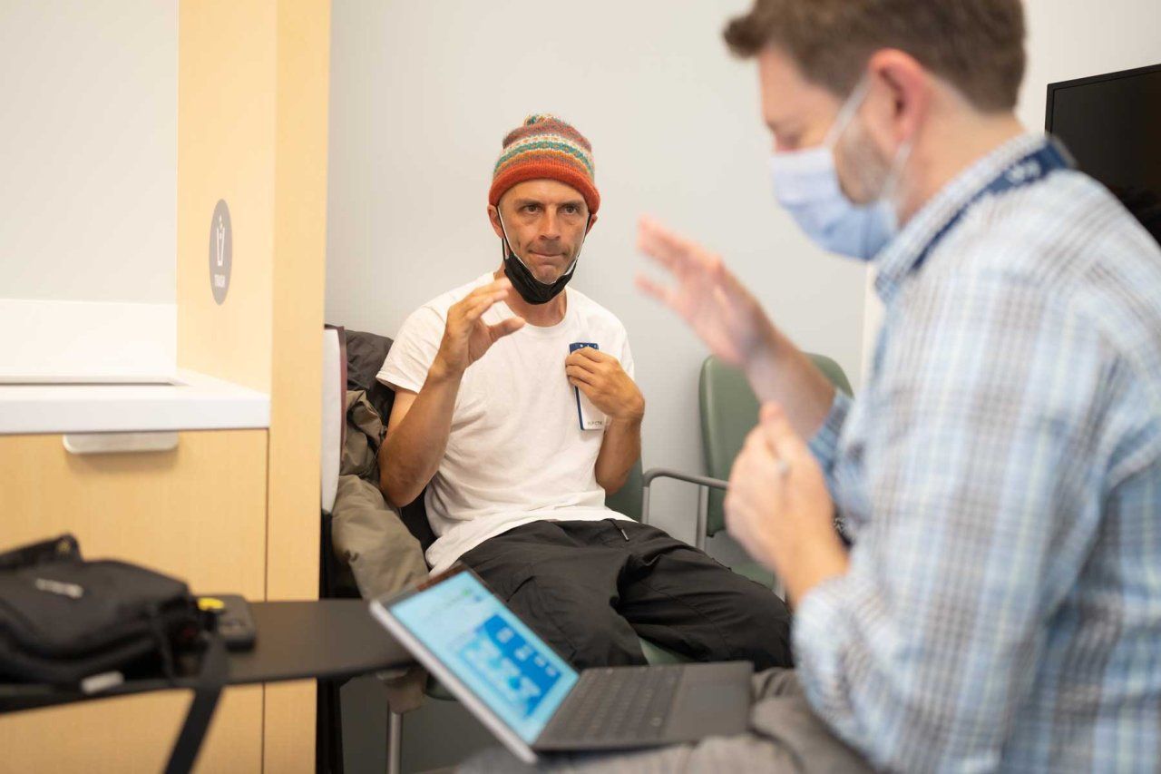 Shawn Connolly works with Nicholas B. Galifianakis, MD, while testing a deep brain stimulation treatment for Parkinson’s disease.