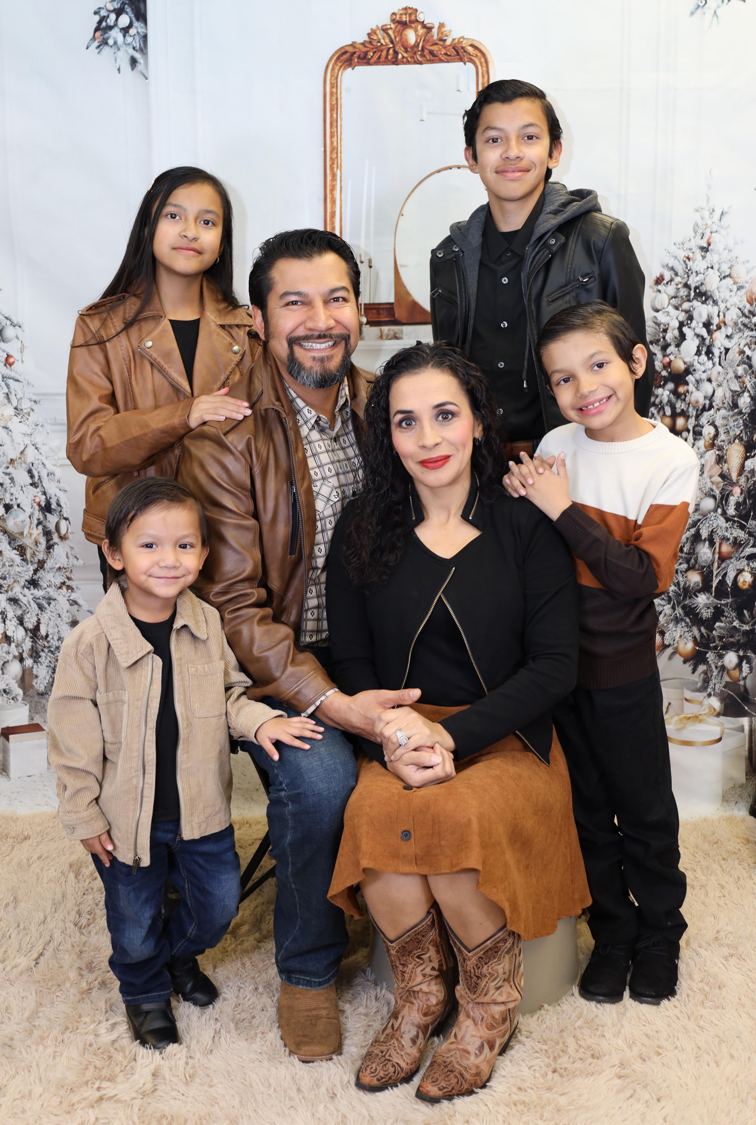 A family with four children posing for a portrait