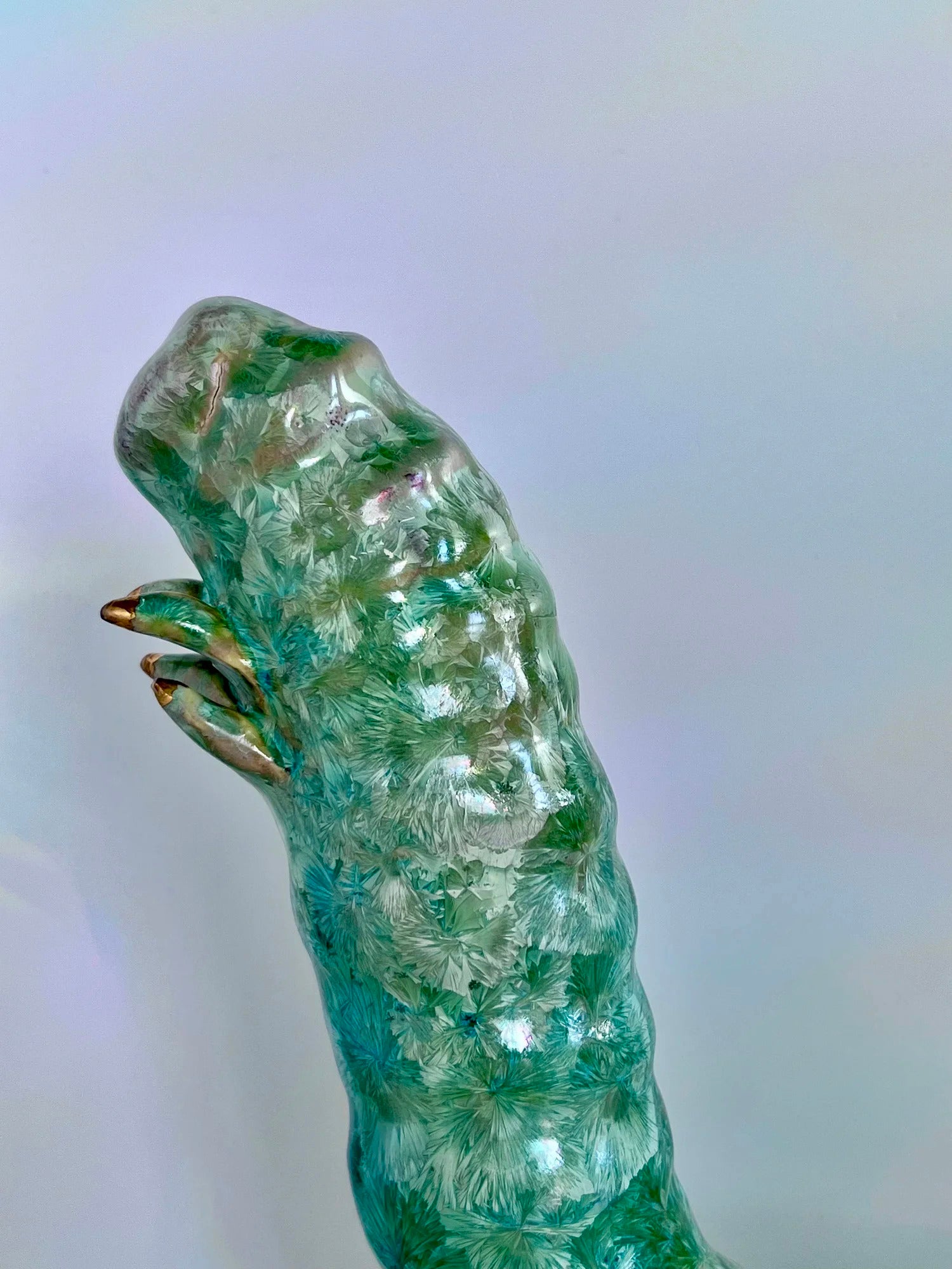 A glazed statue of a silkworm