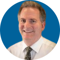 Man wearing a tie smiles