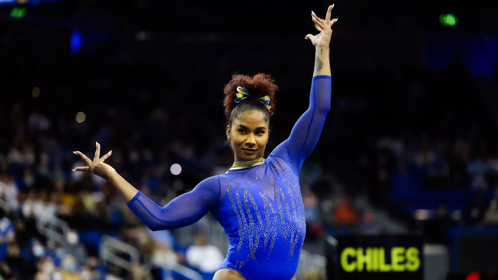 Jordan Chiles poses dramatically in a leotard in competition
