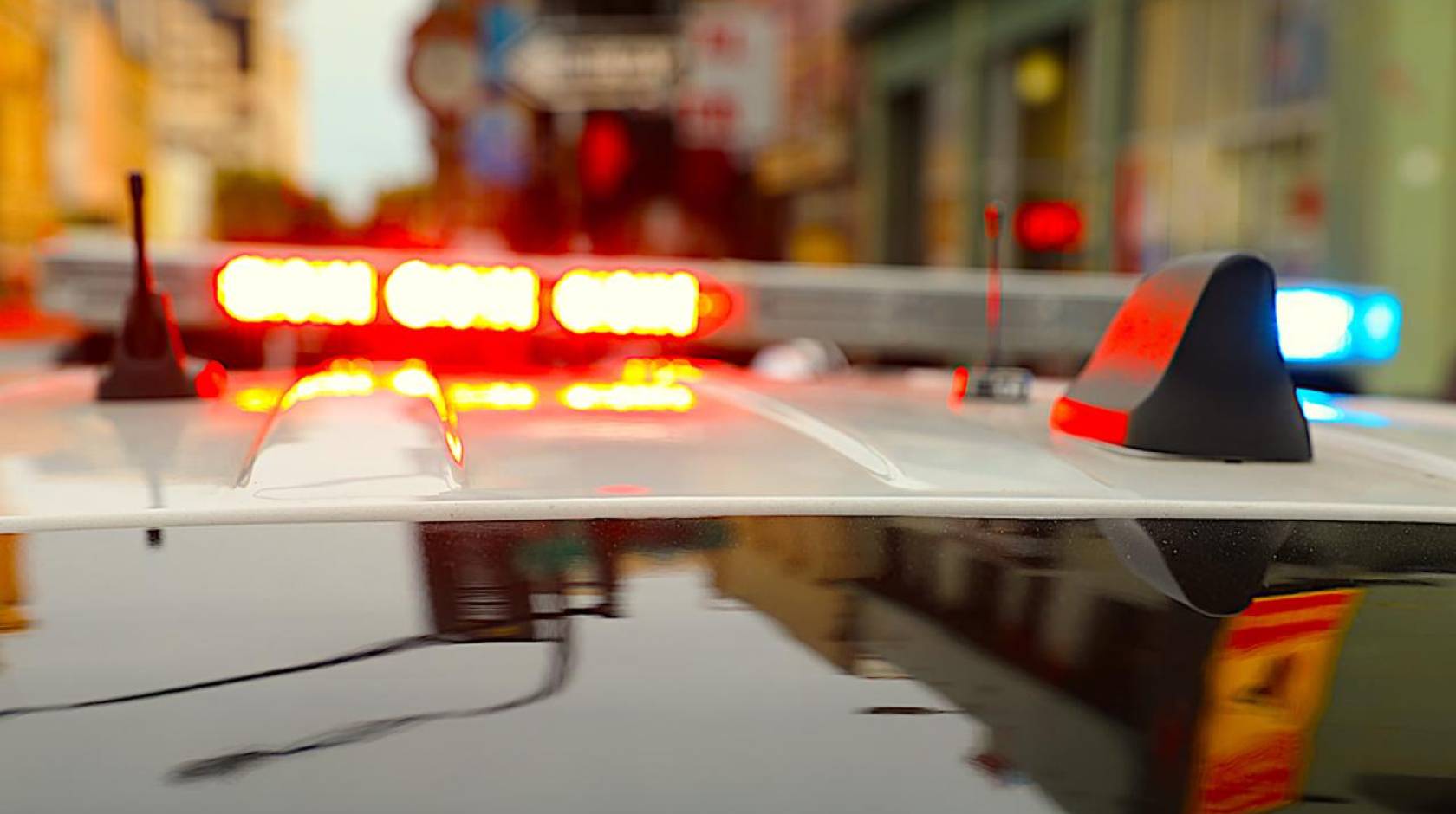 Lights flashing on top of a police car