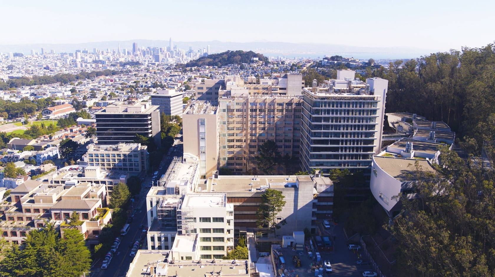 Aerial view of the Parnassus campus in San Francisco, skyline in the background