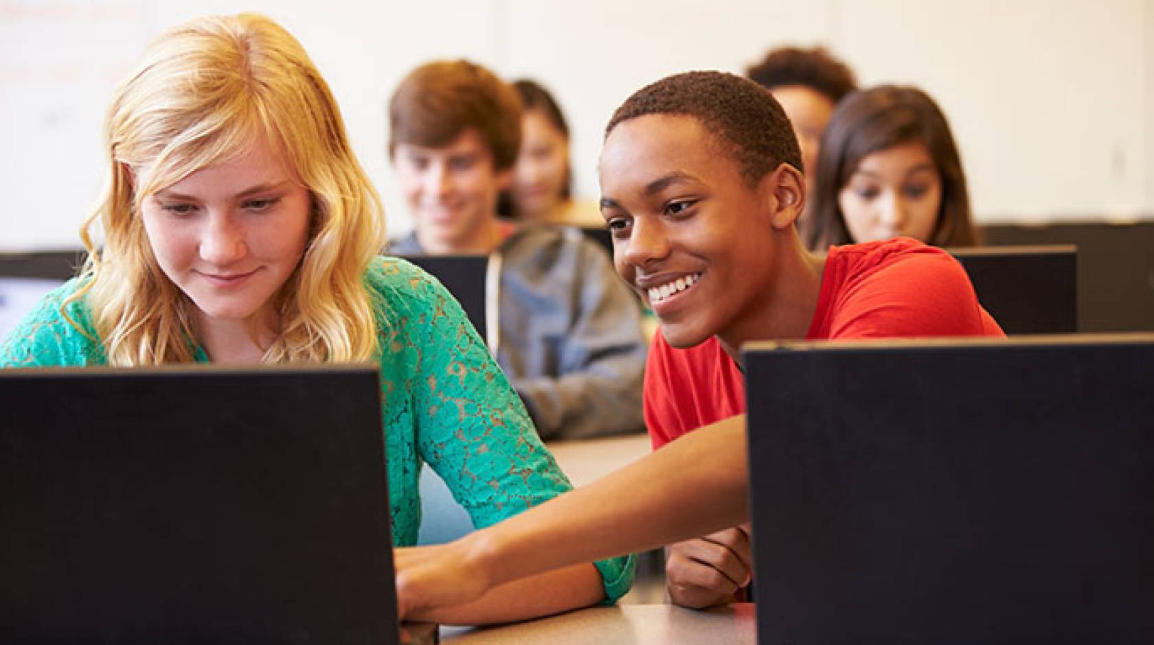 kids in class with laptops
