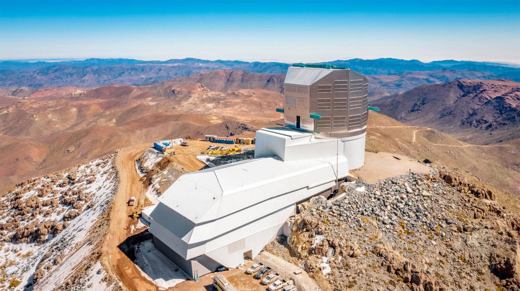 A large astronomical observatory on a bare, rocky mountain peak