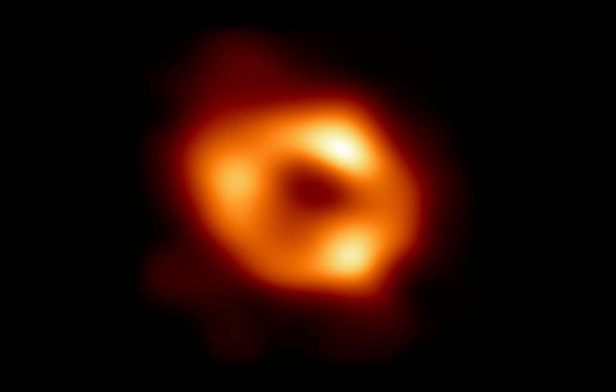The first image of Sagittarius A* (or Sgr A* for short), the supermassive black hole at the centre of our galaxy. Fiery red circular object on black