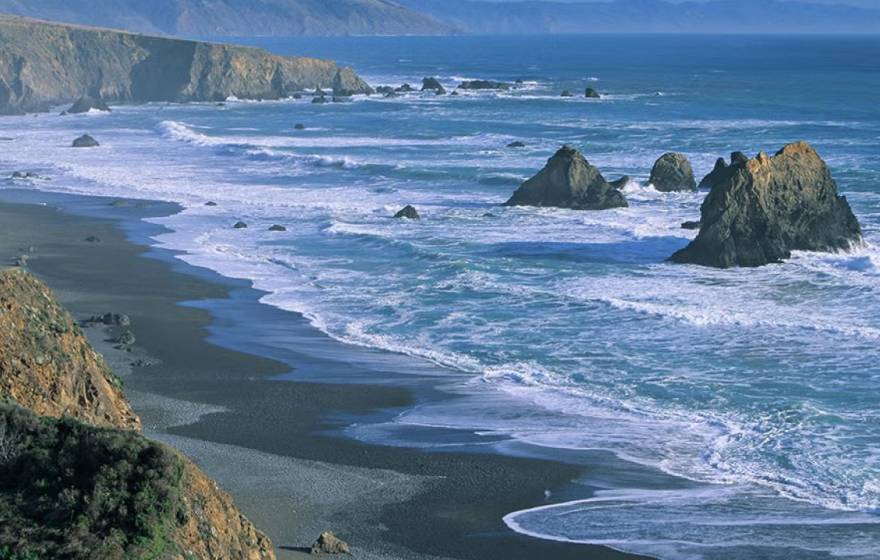 View of the California coast with large rocks in the waves