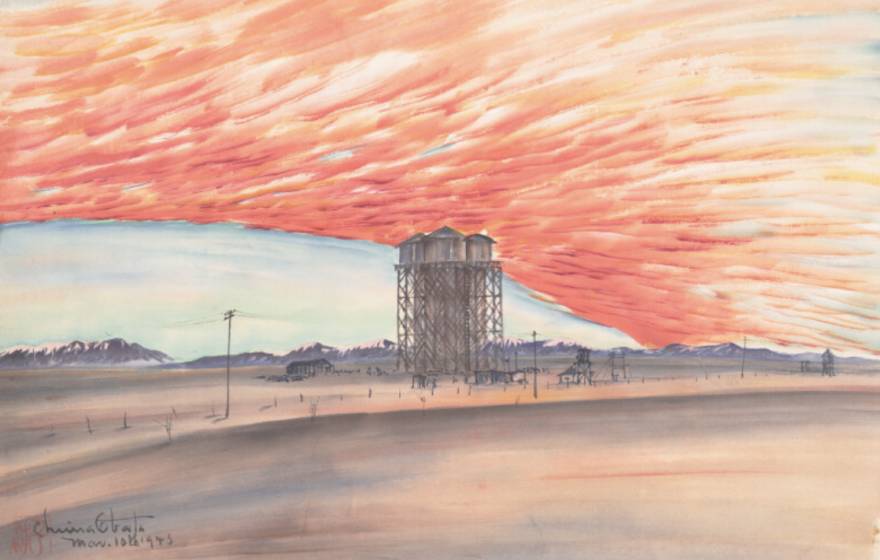A painting showing a blazing sunset behind a watertower in a desolate landscape, with telephone lines in front of the tower and mountains in the far distance