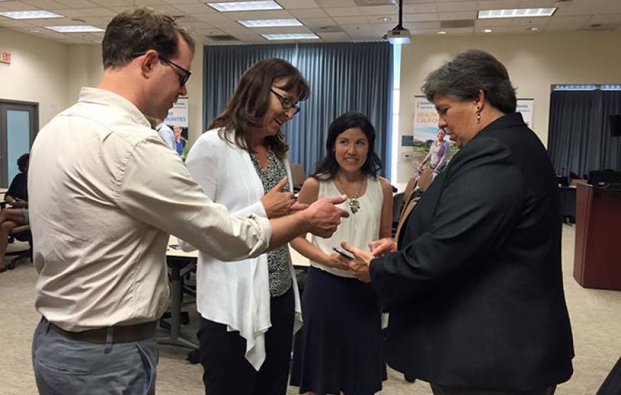 Glenda Humiston (right) at a reception with UC staff her first day with UC ANR. 