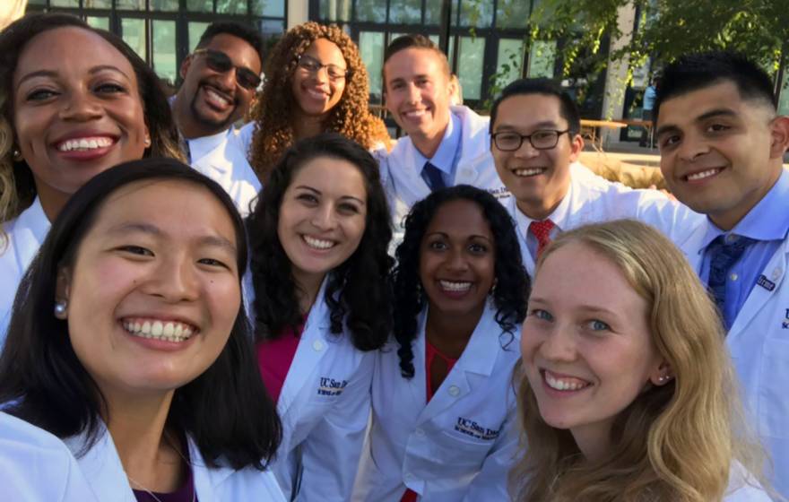 Group selfie of doctors in white coats