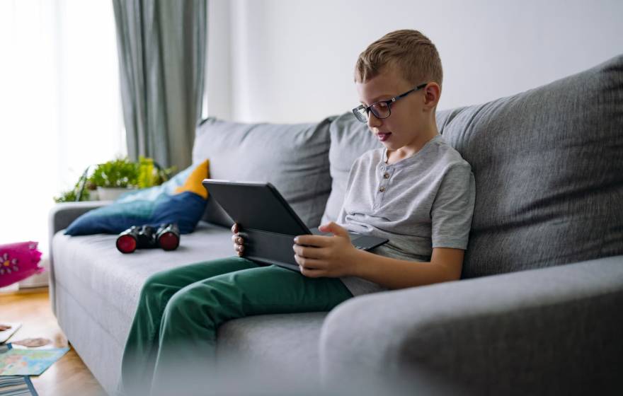 child looking at a tablet
