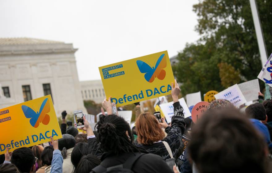 Defend DACA signs at a rally
