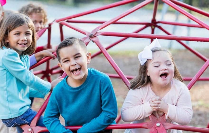 A diverse group of happy children on a playground