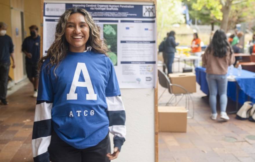 UC Santa Cruz undergraduate student Claudia Paz Flores presents her research from the Haussler-Salama Lab during DNA Day.