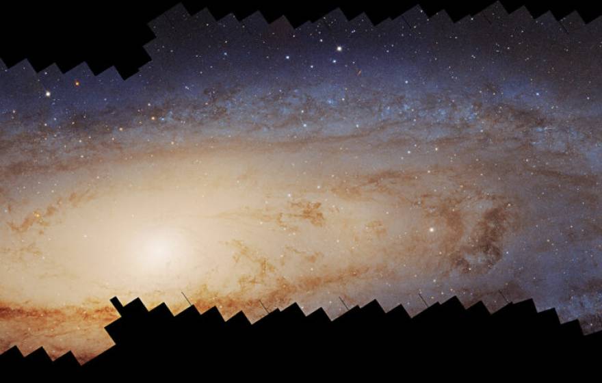 Glowing, swirling stars in a panorama: A photomosaic panorama of the Andromeda galaxy assembled over 10 years by the Hubble Space Telescope