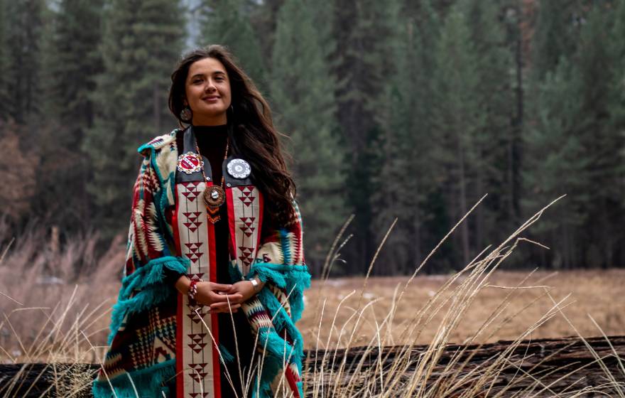 Irene Vasquez at Yosemite in traditional tribal clothing