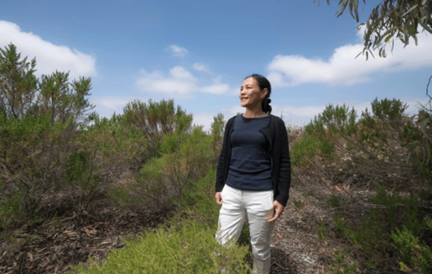 Study author Jun Wu in a brush-filled field
