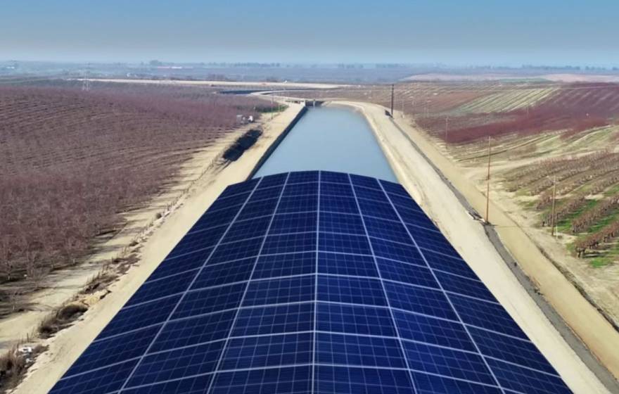 A rendering of solar panels covering an agricultural canal