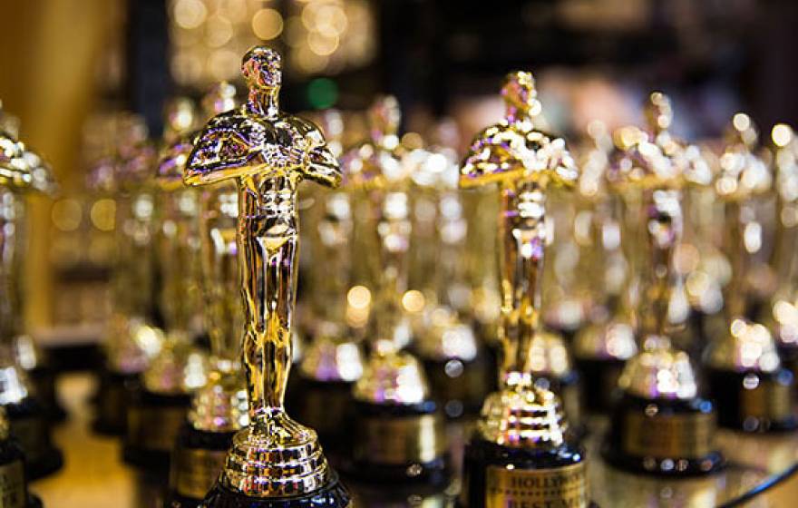 Oscar statuettes in a row