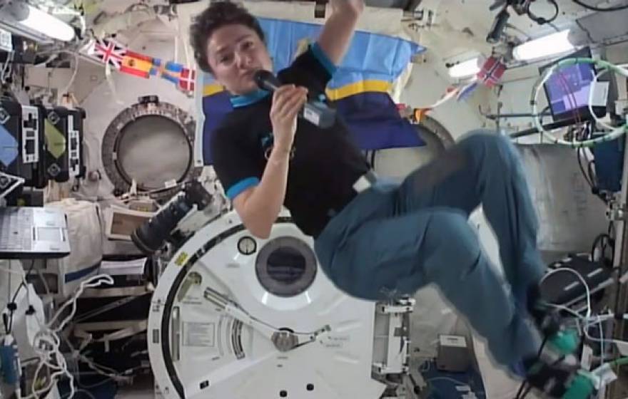 Jessica Meir floating in space taking questions