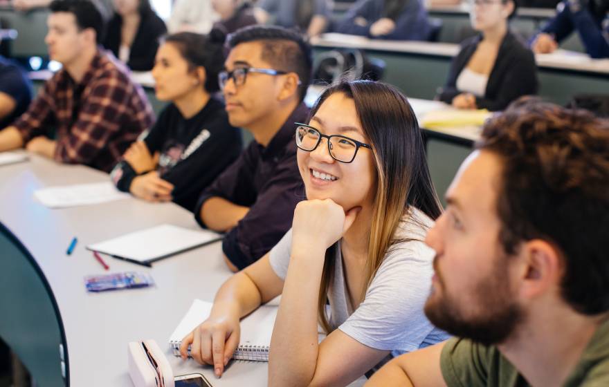 smiling college students in a classroom