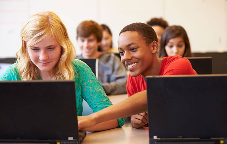 kids in class with laptops