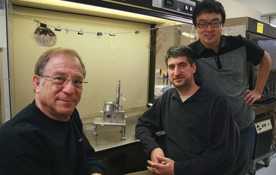 3 scientists sitting in a lab