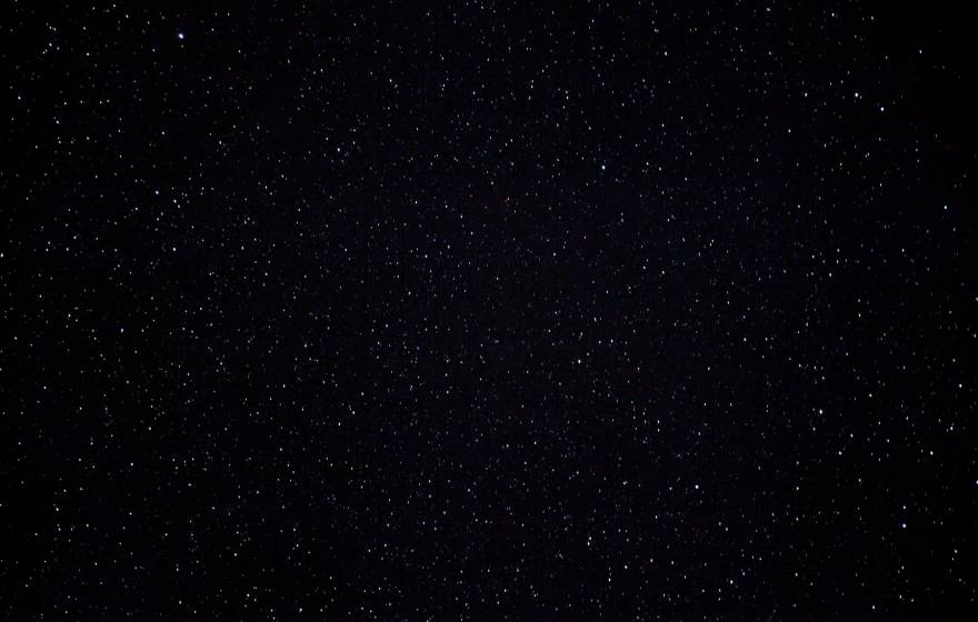 A dark, starry night sky