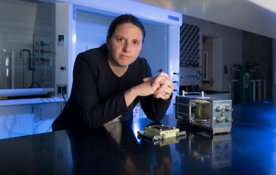 Iryna Zenyuk standing at a desk