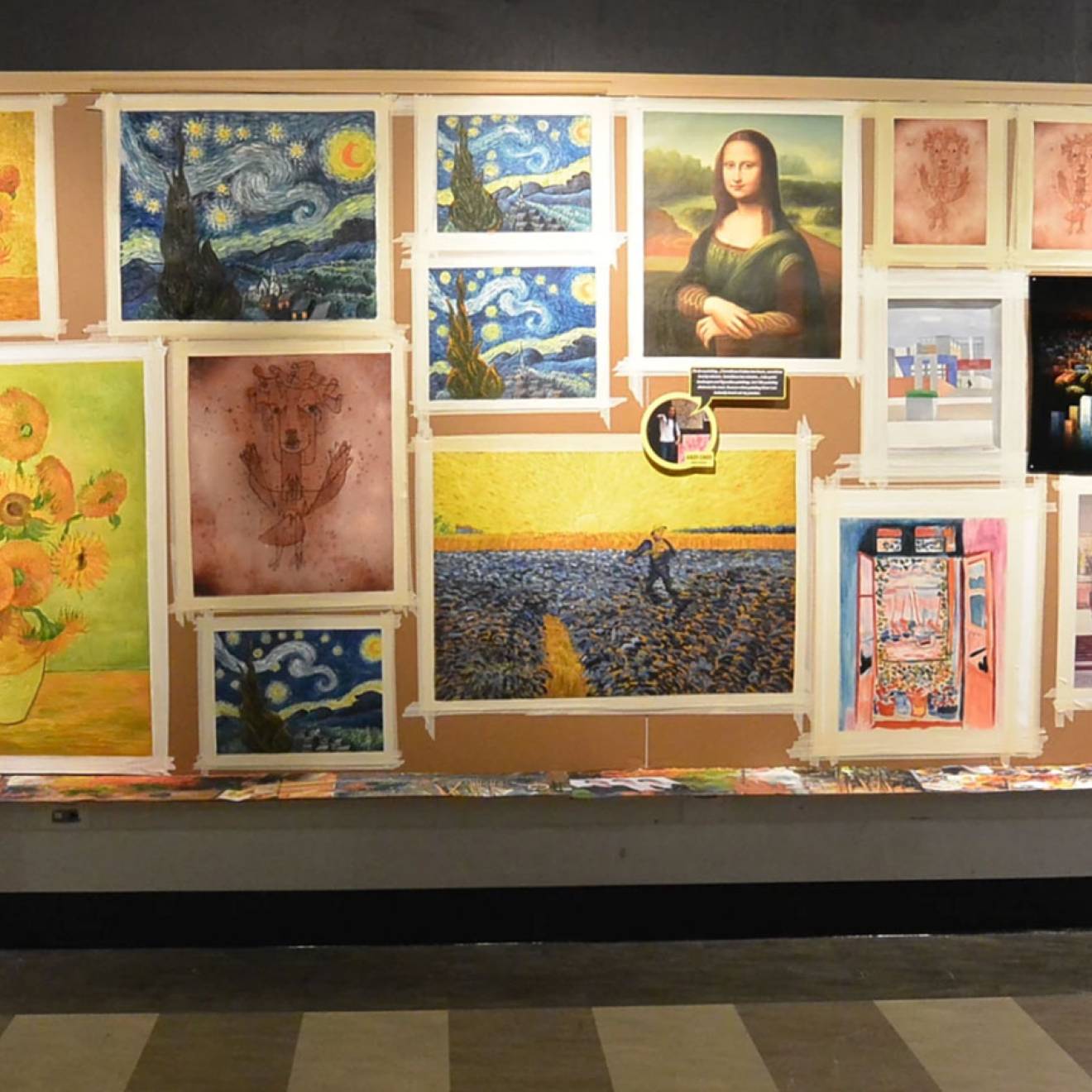 A museum gallery wall showing several versions of iconic paintings, including the Mona Lisa and Starry Night