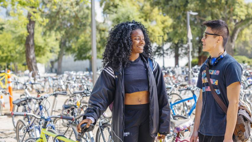 students on Davis campus with bikes